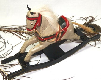 seesaw horse toy