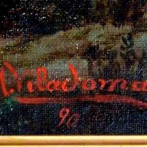 May include: A red signature on a dark blue canvas reads "M. Villadona" with the number "9/2" below it.