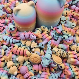 May include: A collection of colorful, 3D-printed animal toys, including turtles, tigers, and cats, in pastel rainbow hues. Two large cat-shaped containers are in the background. The toys are segmented, creating a unique design.