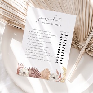 May include: A printable baby shower game with the title "Guess Who? Mommy or Daddy". The game has 12 questions about the parents and the baby, with a space to circle either "Mommy", "Daddy", or "Both" for each question.