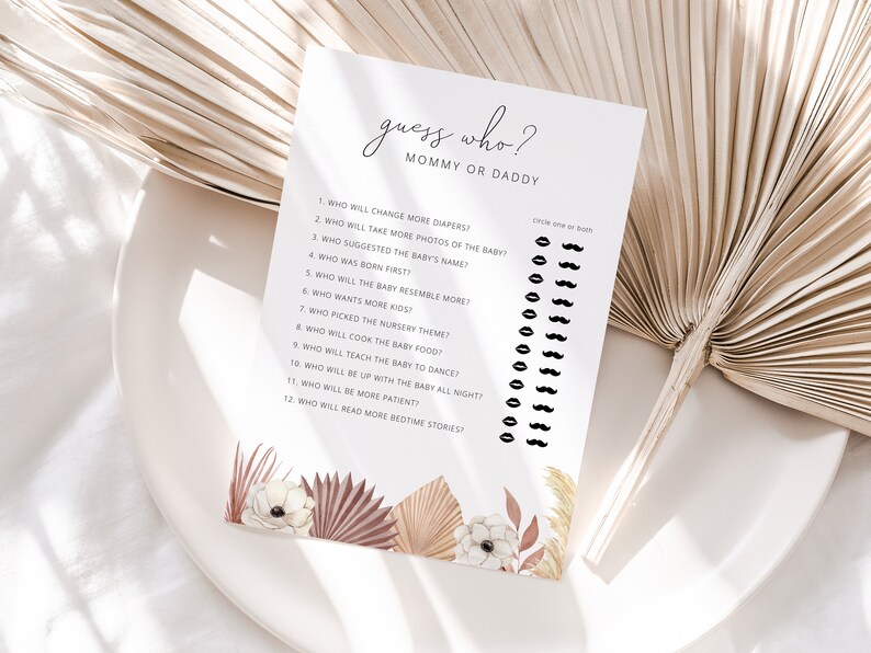 May include: A printable baby shower game with the title "Guess Who? Mommy or Daddy". The game has 12 questions about the parents and the baby, with a space to circle either "Mommy", "Daddy", or "Both" for each question.