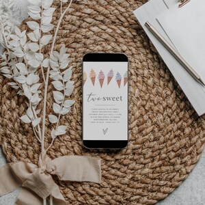 May include: A smartphone displaying a digital invitation for a child's second birthday party. The invitation features a colorful illustration of ice cream cones and the text "two sweet".