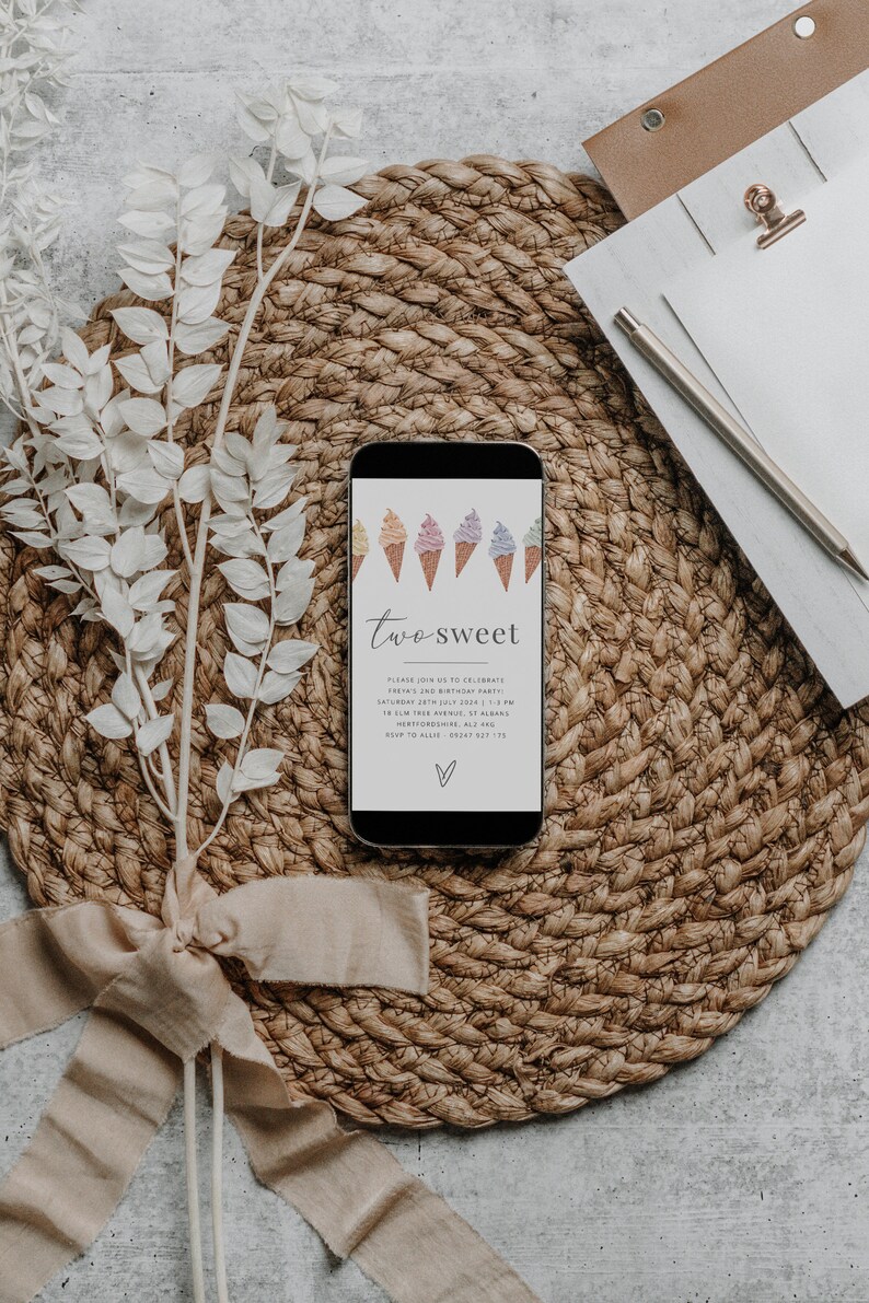 May include: A smartphone displaying a digital invitation for a child's second birthday party. The invitation features a colorful illustration of ice cream cones and the text "two sweet".