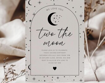 May include: A light gray invitation card with a black crescent moon and stars. The text reads "We love you" and "Two the moon". The invitation is for a second birthday party.