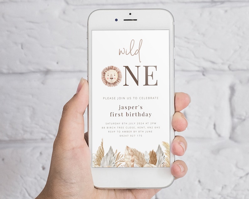 May include: A digital invitation for a first birthday party with a lion illustration and the text "wild ONE". The invitation includes the child's name, date, time, and location of the party. RSVP information is also included.