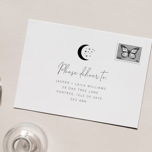 May include: A white envelope with a black moon and stars design. The envelope is addressed to Jasper and Laila Williams at 28 Oak Tree Lane, Portree, Isle of Skye, SK2 4BN.