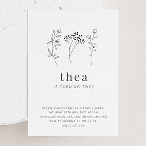 May include: A white invitation card with black text and a simple floral illustration. The text reads "thea is turning two!" and includes details for a birthday party.
