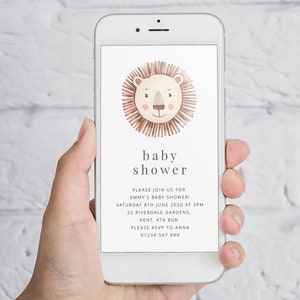 May include: A smartphone displaying a baby shower invitation with a lion illustration. The invitation reads "baby shower" and includes the date, time, location, and RSVP information.