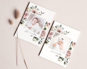 May include: Two floral baby milestone cards with photos of a baby girl. The first card says "five months" and the second card says "six months".
