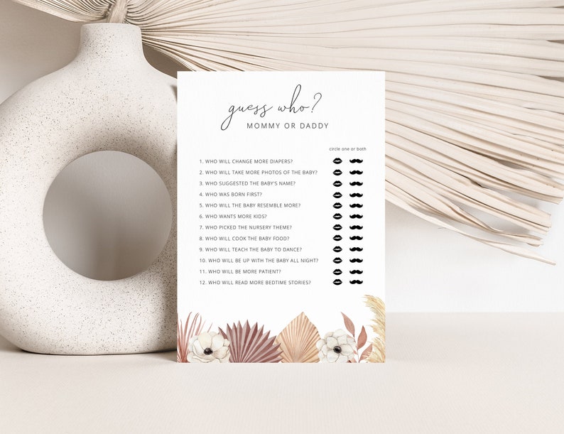 May include: A printable baby shower game card with the title "Guess Who? Mommy or Daddy" and a list of questions about the parents-to-be. The card has a floral design with pink, white, and brown colors.