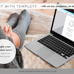 May include: A laptop computer displaying a printable template for a "first trip" itinerary. The template features a simple sun graphic and the text "first trip,  around the sun". The laptop is on a white knitted blanket.