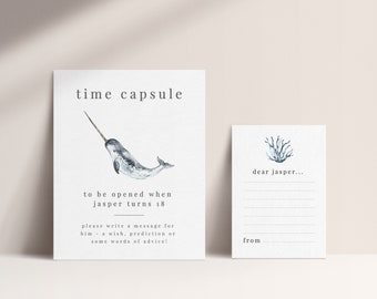 Può includere: Un biglietto bianco con un'illustrazione di narvalo e il testo "time capsule to be opened when jasper turns 18. Please write a message for him - a wish, prediction or some words of advice!" e un secondo biglietto bianco con un'illustrazione di corallo blu e il testo "dear jasper... from".