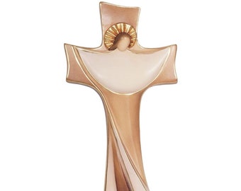May include: A wooden wall cross with a stylized depiction of Jesus Christ in a white robe with gold accents. The cross is painted in shades of brown and gold.