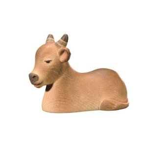 May include: A brown wooden figurine of a cow lying down with its eyes closed. The cow has black horns and a brown nose.