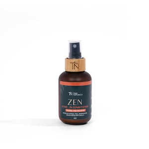 May include: A brown bottle with a wooden cap and a black spray nozzle. The bottle is labeled "TN Tree Naturals Zen Leave-In Conditioner for Men - Hair and Beard. Notes of Citrus, Pine, Sandalwood, Cedar Wood and Vanilla. 4 fl oz."