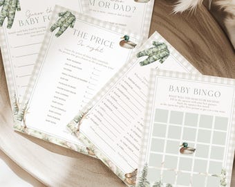 May include: A set of baby shower game cards with a woodland theme. The cards feature illustrations of ducks, trees, and baby clothes. Text includes "Guess the Baby Food", "Guess Who M or Dad?", "The Price is Right", and "Baby Bingo".