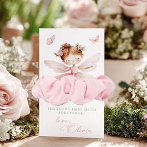 May include: A greeting card with a fairy illustration, featuring a pink dress and wings. The card includes the text "Thank you fairy much for coming!" and "love, Olivia". Two butterflies are also depicted in the design.