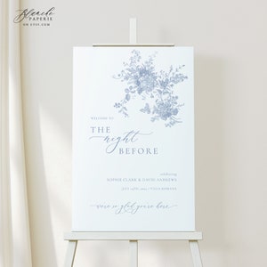 May include: A white welcome sign with blue floral illustrations and the text "Welcome to the night before celebrating Sophie Clark & David Andrews July 14th, 2023 Villa Romana were so glad you're here".