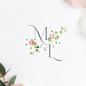 May include: A floral monogram with the letters "M" and "L" in a gray script font. The letters are adorned with pink flowers and green leaves.