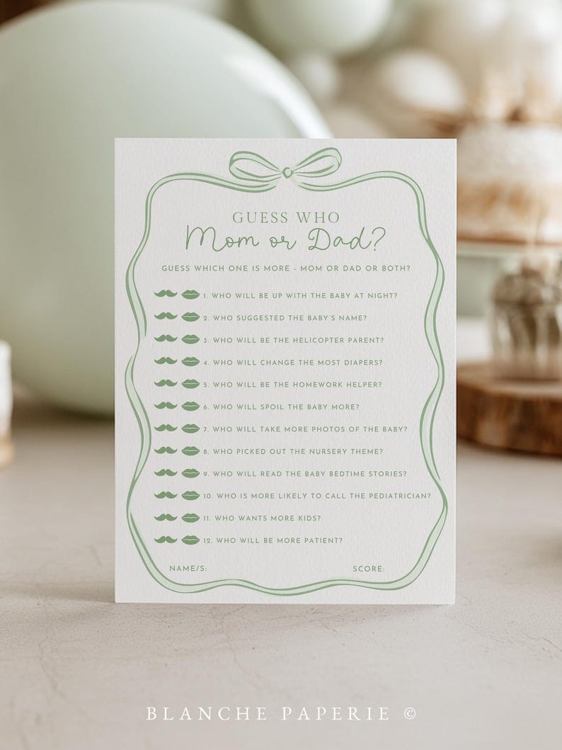 May include: A light green baby shower game card with the text "Guess Who Mom or Dad?" and a list of questions. The card has a decorative border and bow design. The bottom of the card reads "Blanche Paperie".