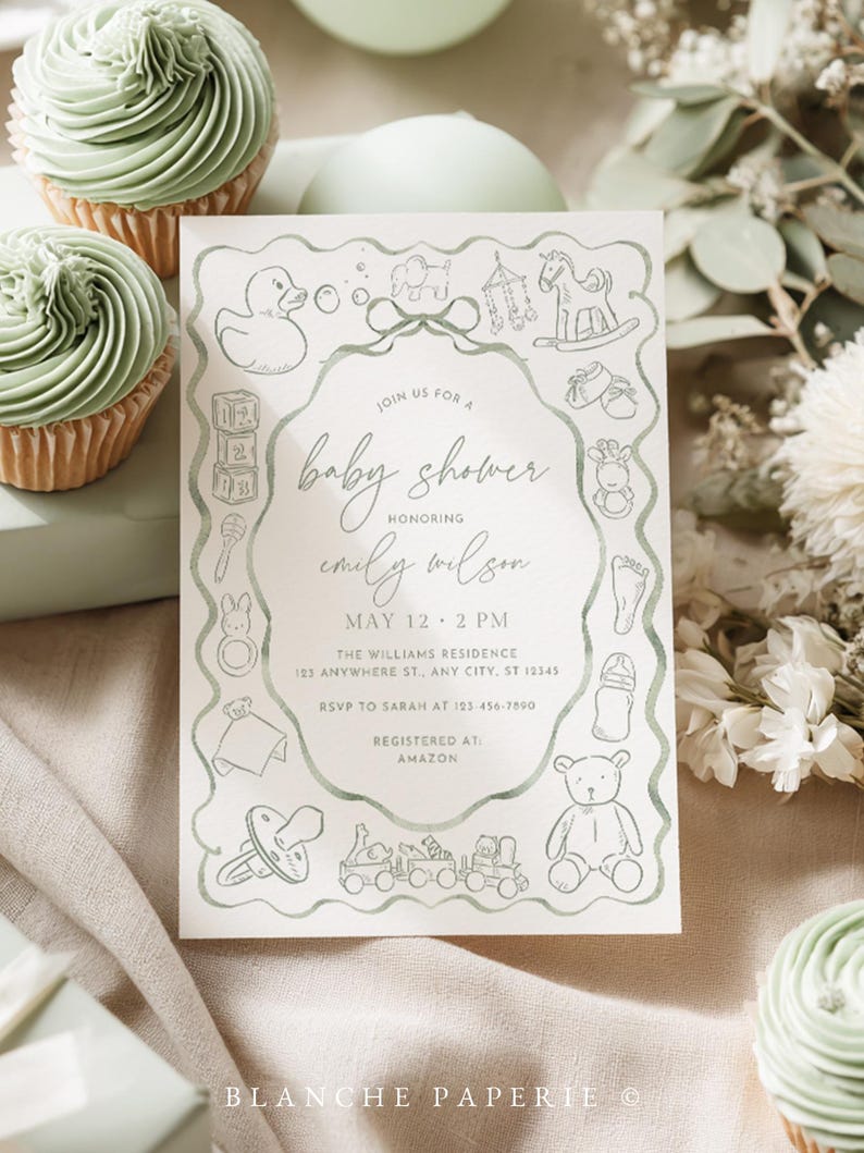 May include: A baby shower invitation with a soft green border and illustrations of baby-related items. The invitation text reads "baby shower" and includes the honoree's name, date, time, and location. Cupcakes with green frosting are in the background.
