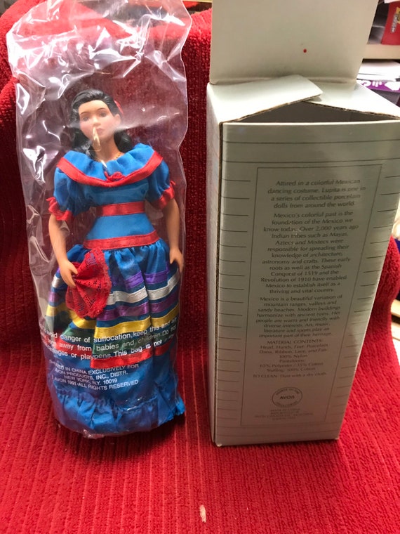 avon international porcelain doll collection