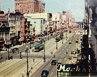 Real Photo Postcard of Canal Street in New Orleans, Louisiana. 1950-60s ?