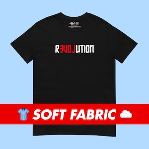 May include: Black t-shirt with the word "REVOLUTION" printed in white letters with the "LOVE" portion in red.