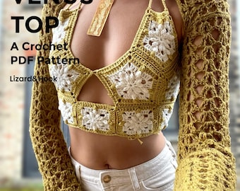 Op de afbeelding: Een gehaakte top en bolero set in olijfgroen en wit. De top heeft een halternek en bloemendetails. De tekst op de afbeelding luidt "THE VENUS TOP, A Crochet PDF Pattern, Lizard & Hook."