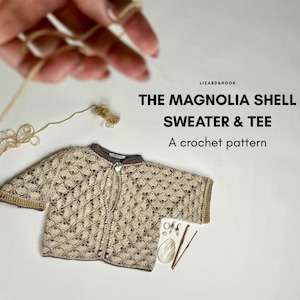 May include: A crocheted sweater and tee in beige and brown tones, with a shell pattern. The text reads "THE MAGNOLIA SHELL SWEATER & TEE A crochet pattern". Crochet hooks and yarn are also visible.