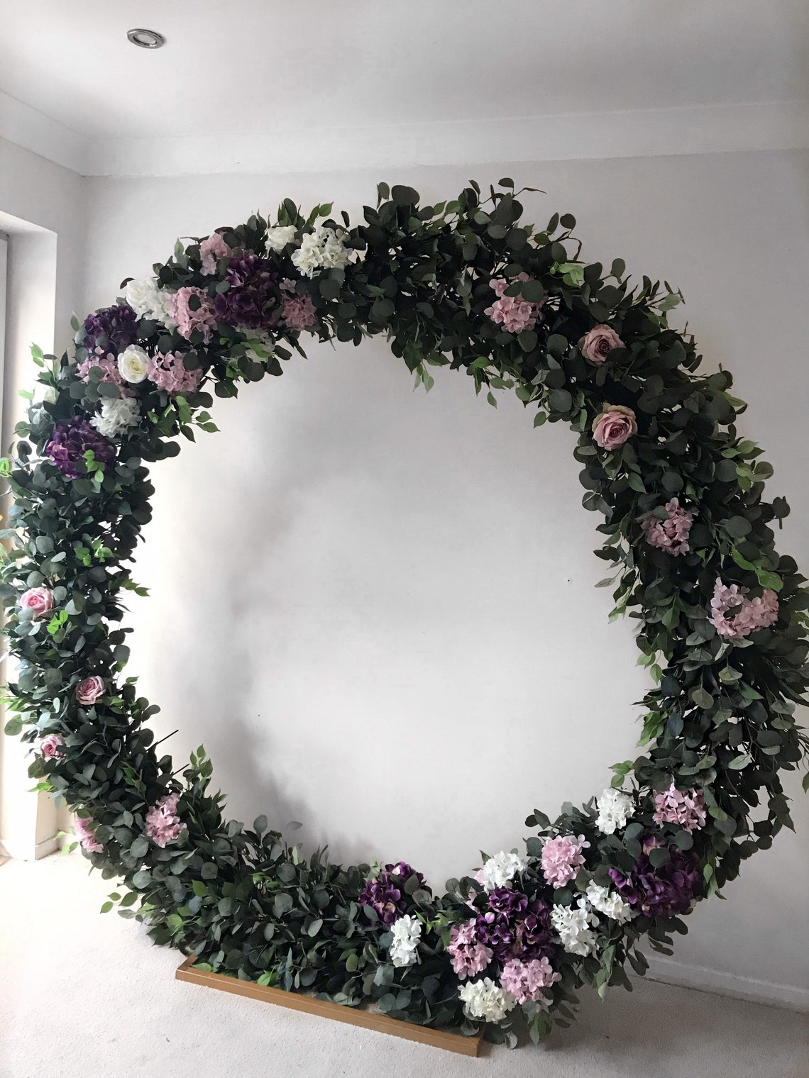 Eucalyptus flower garland Round wedding archMoongate arch image 1