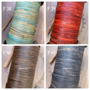 May include: Four spools of flat leather cord labeled F 38, F 39, F 40, and F 41, each featuring the text AntiqueCord. The cords are displayed in turquoise, red, dark brown, and black, all showing a distressed, weathered texture throughout.