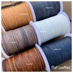 May include: Spools of flat leather cord in various colors, including brown, tan, gray, white, and blue. The spools are labeled "Antique Cord" and "Flat Leather".