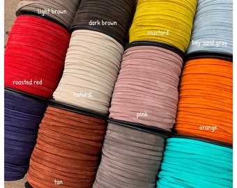 May include: A collection of 12 spools of 5mm suede leather lace in various colors, including light brown, dark brown, mustard, bay sand gray, roasted red, natural, pink, orange, tan, fuchsia, and mint.