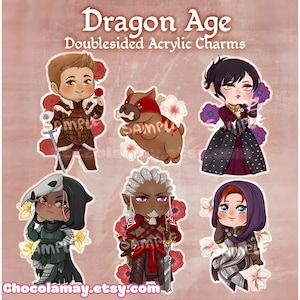 May include: Dragon Age doublesided acrylic charms featuring six chibi-style characters. The charms include a man holding a rose, a dog with a bone, a woman in a dress, a character with a skull mask, a character with white hair, and a woman in a hood.