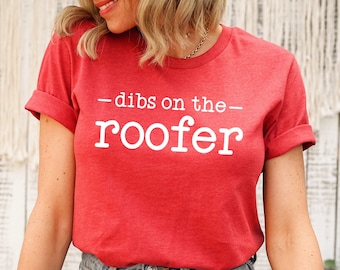 May include: Red t-shirt with white text that reads "—dibs on the— roofer".