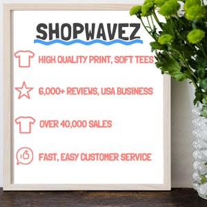 May include: A white sign with the text "SHOPWAVEZ" in black, followed by a blue wavy line. The sign lists four benefits of shopping with the company: high quality print, soft tees, 6,000+ reviews, USA business, over 40,000 sales, and fast, easy customer service.