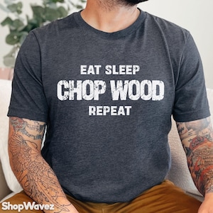 May include: A dark gray t-shirt with the text "Eat Sleep Chop Wood Repeat" in white.