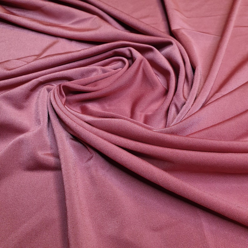 Burnt orange light weight stretch shimmer knit jersey dressmaking fabric price per metre 160cm 63 width