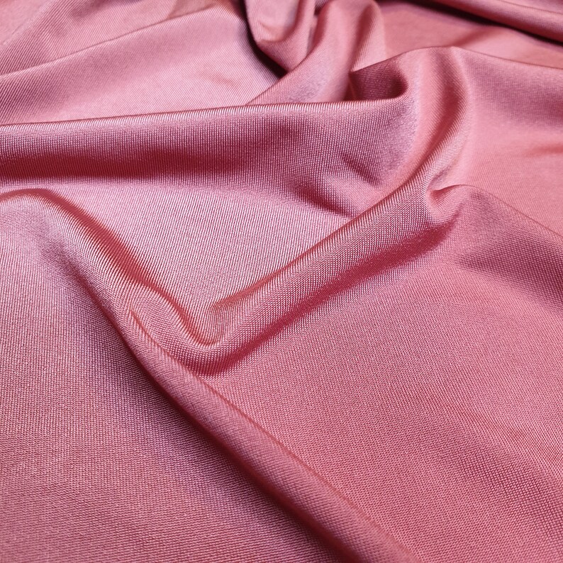 Burnt orange light weight stretch shimmer knit jersey dressmaking fabric price per metre 160cm 63 width