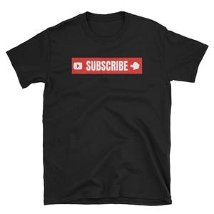 May include: Black t-shirt with a red rectangle that says "SUBSCRIBE" with a white play button and a white thumbs up icon.