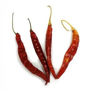 May include: Four dried red chili peppers, with one curled into a U shape.