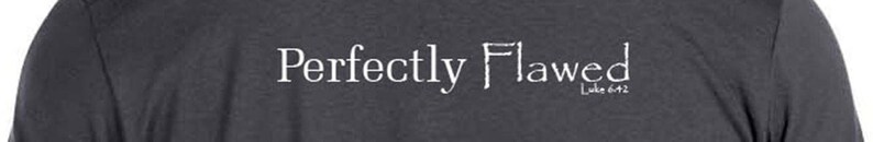 May include: A dark gray long-sleeve shirt with the text "Perfectly Flawed" in white lettering.