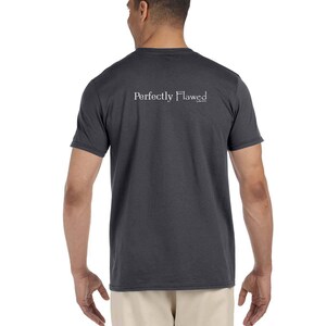 May include: A dark gray t-shirt with the text "Perfectly Flawed" printed on the back in white.