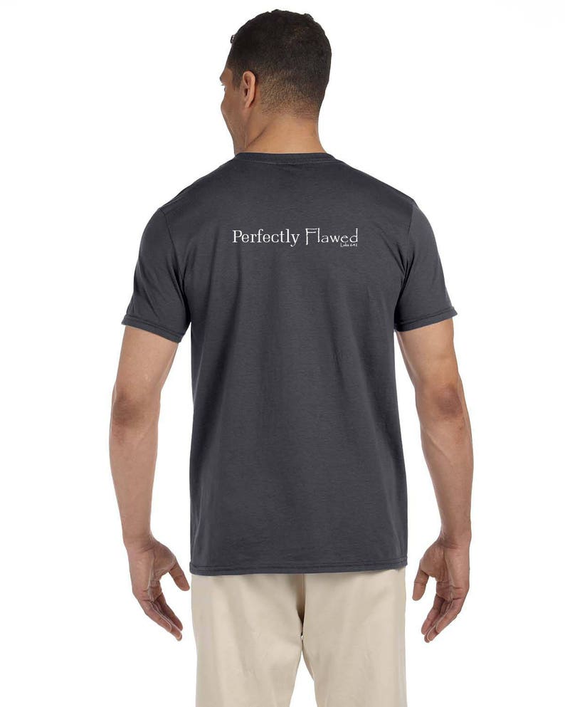 May include: A dark gray t-shirt with the text "Perfectly Flawed" printed on the back in white.