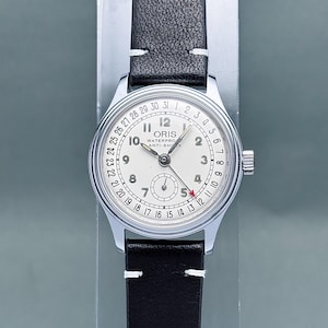 vintage ORIS aiguille date petite seconde cadran blanc 32 mm