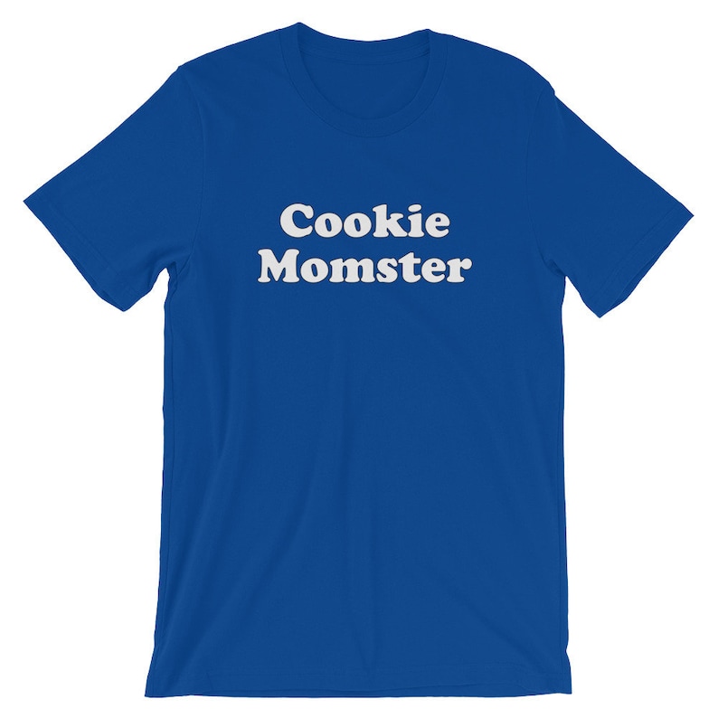 May include: A royal blue t-shirt with the text "Cookie Momster" in white.