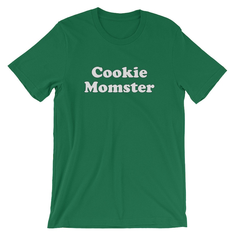 May include: A green t-shirt with the text "Cookie Momster" in white.