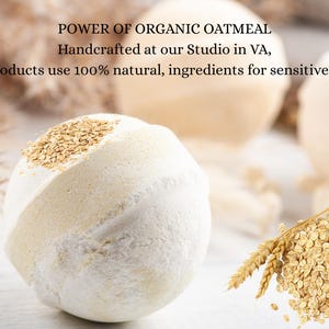 May include: A close-up of a white and beige bath bomb with oatmeal flakes on top. The text "POWER OF ORGANIC OATMEAL" is visible, along with other text. A pile of oatmeal and wheat stalks are in the foreground. The bath bomb is for sensitive skin.
