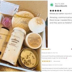 May include: A gift box filled with self-care products, including a jar labeled "Lavender Dream", a loofah sponge, a bath bomb, and a candle. The box also contains a body butter and two tubes of lotion. The products are arranged in a white box.